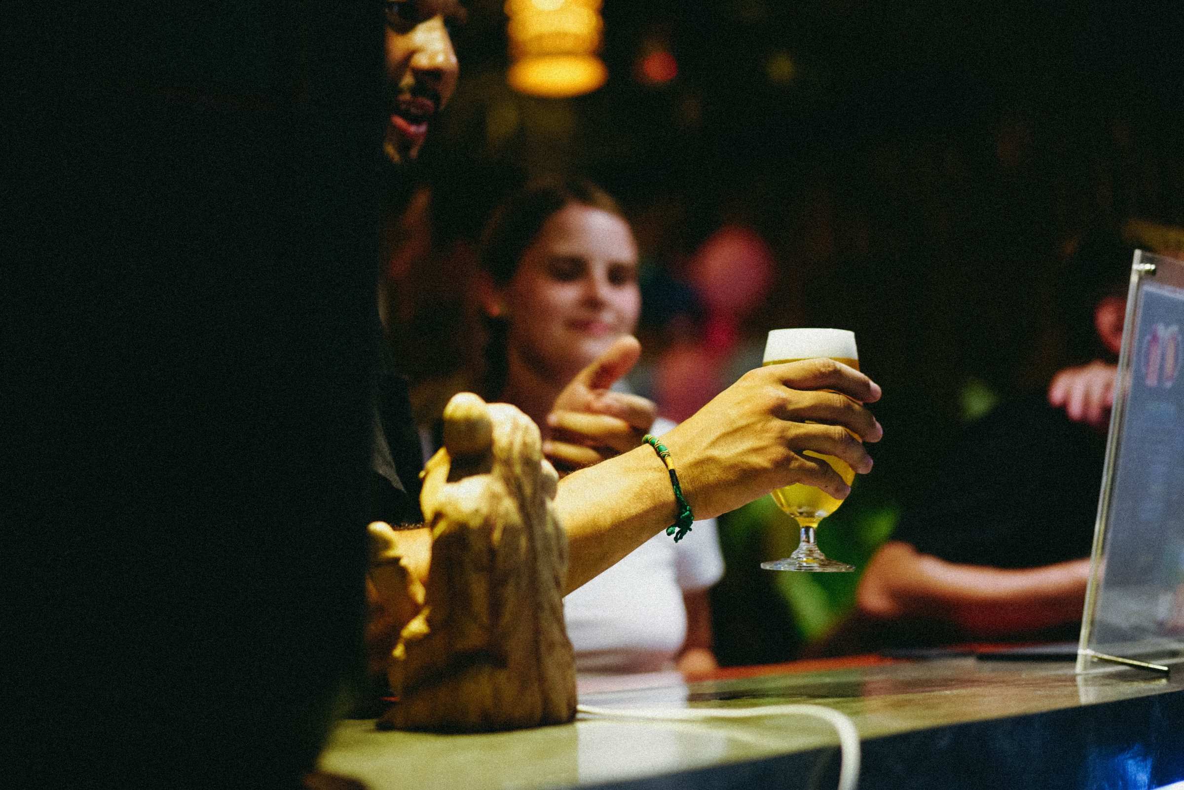 Guest with a beer at the bar