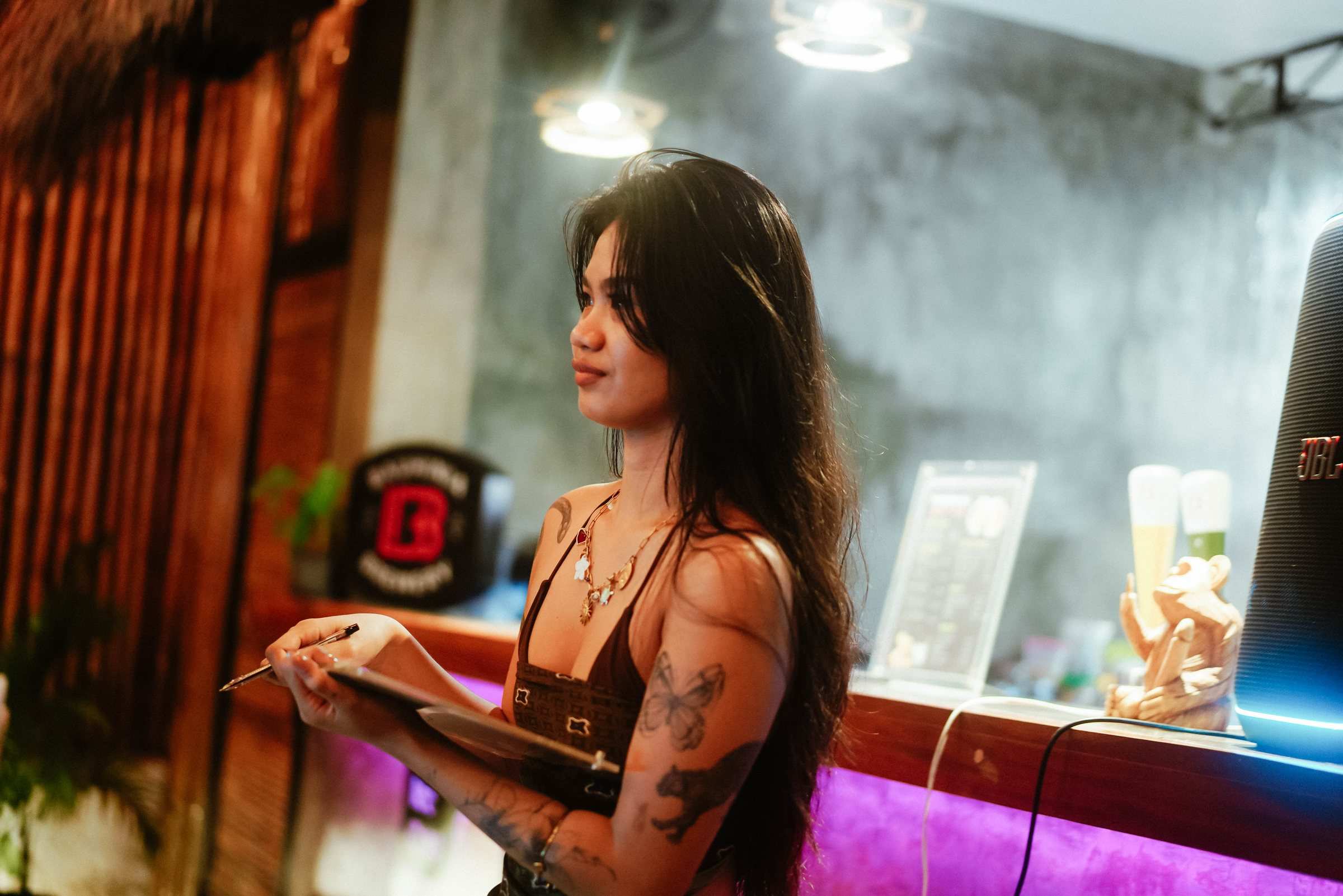 Guest writing an answer at the bar