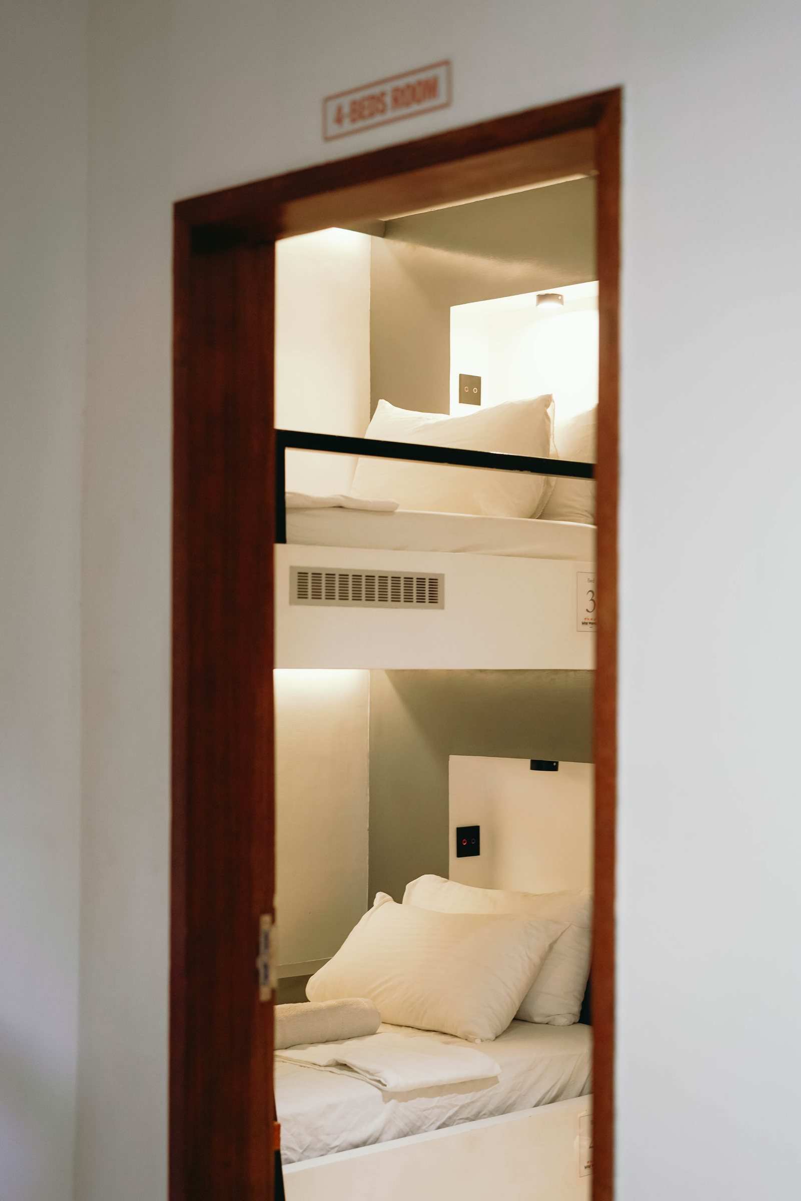 Bunk with pillows in the 4-bed dorm