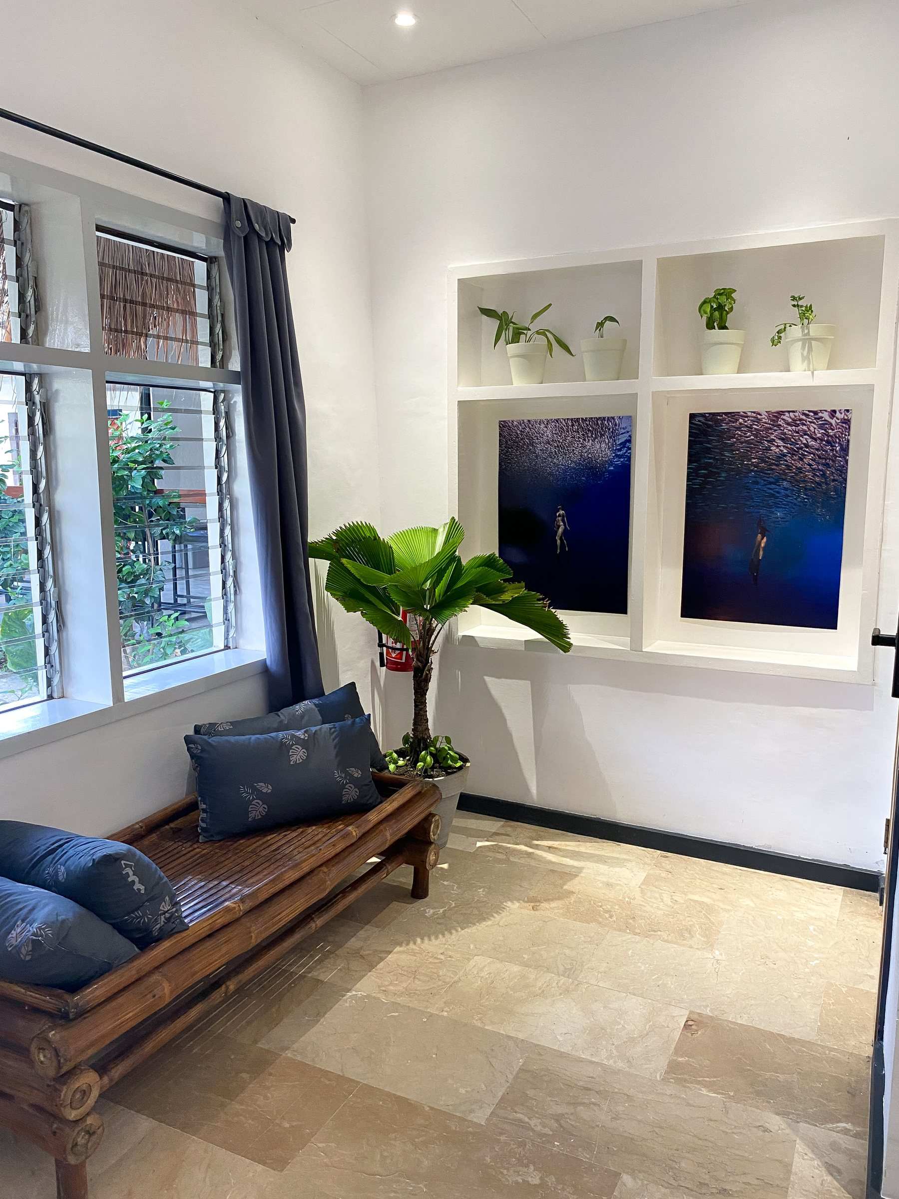 Window seat and ocean artwork