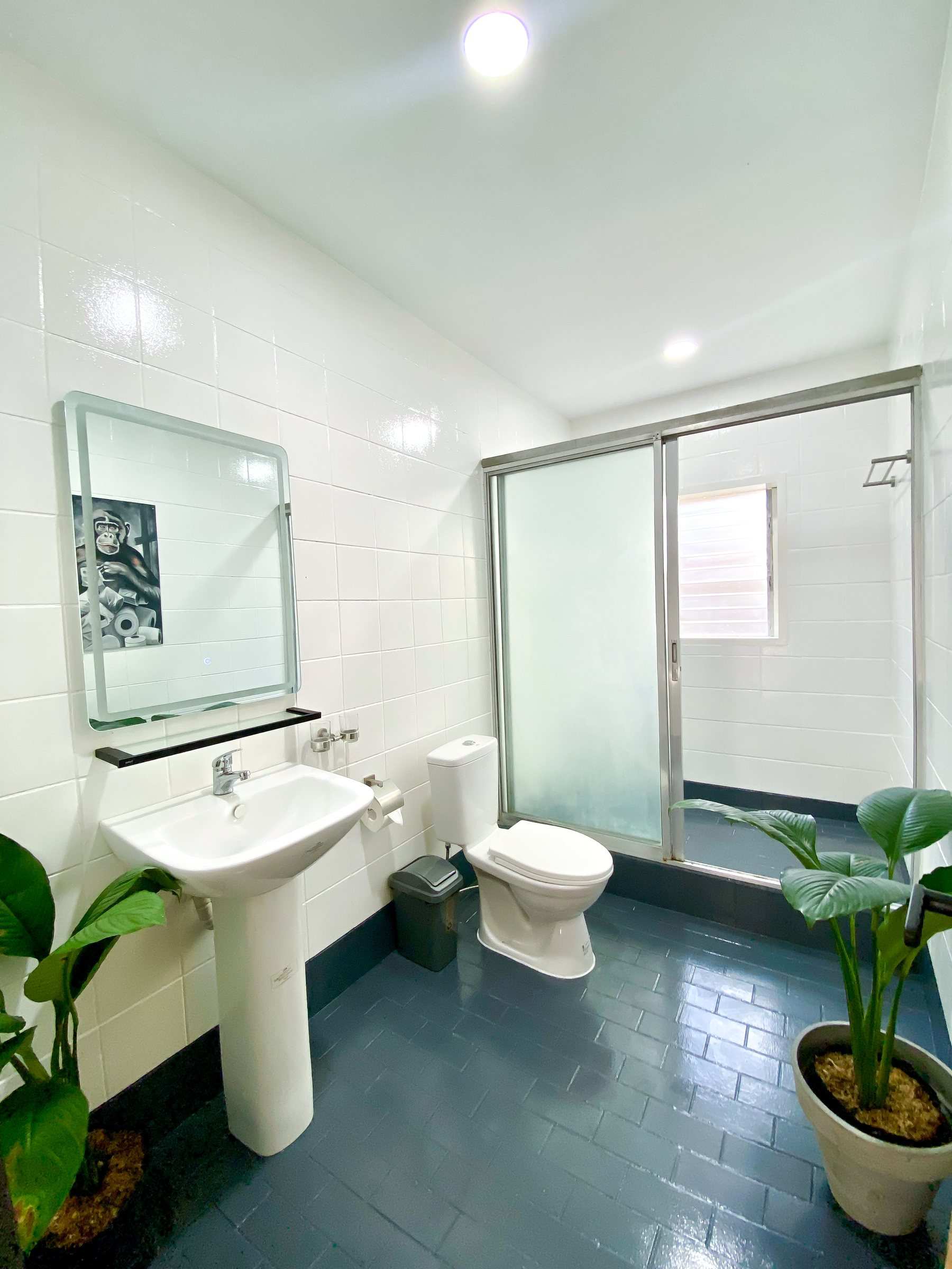 Private bathroom with sink and glass shower